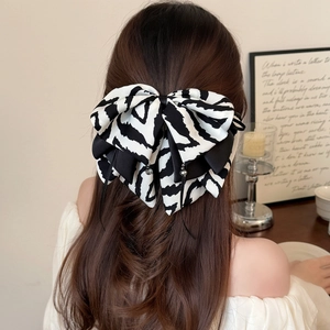 Elegant zebra stripe bow hair claw with satin ribbon and bead charms for women