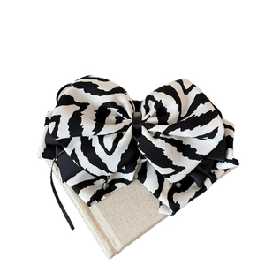 Zebra pattern oversized bow hair clip with beaded pendants for elegant women's styling