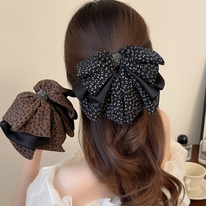 Floral ribbon bow hair claw clip with leopard print and rhinestone accent for women