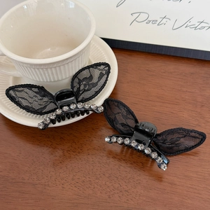 Elegant pair of black lace butterfly hair clips with sparkling rhinestones and studs