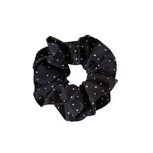 French style black scrunchie with white heart polka dots and ruffled edge details