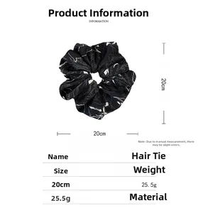 Size chart showing a 20cm large fabric scrunchie with white wavy lines on black material