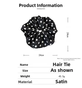 Detailed view of satin polka dot scrunchie with pearls and size specifications