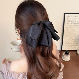 Elegant black satin bow hair claw with sparkling rhinestones for women's hairstyle
