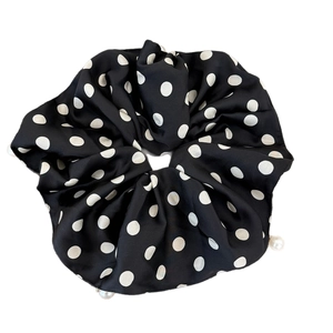 Elegant black polka dot satin scrunchie with white pearl fringe for stylish hair styling