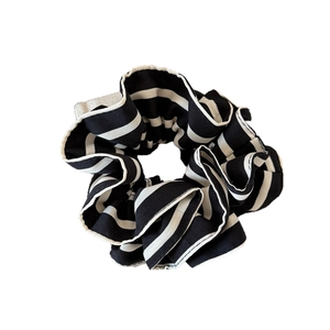 Chic oversized black and white striped ruffled fabric scrunchie with layered design