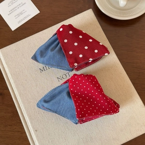 Detail of red polka dot and blue denim patchwork fabric for French style hair clips