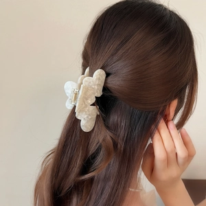 Elegant cream acetate butterfly hair claw clip with marble texture for half-up hairstyles