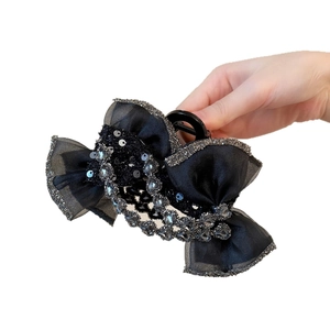 Pince à cheveux nœud noir élégante avec strass et satin pour coiffure de femme raffinée