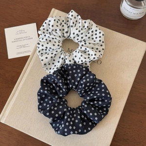 Floral chiffon scrunchies set in black and cream colors for elegant hair styling