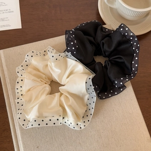 Detail of satin scrunchies with polka dot mesh lace and double layered ruffle edges