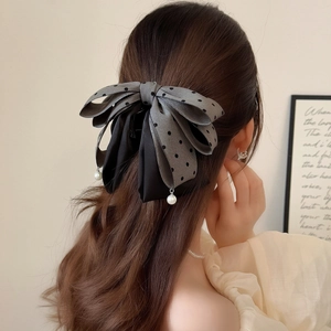Elegant grey polka dot mesh bow hair clip with pearl pendants for a retro ponytail look