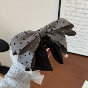 Elegant grey polka dot bow hair claw clip with pearl pendants and black fabric detail