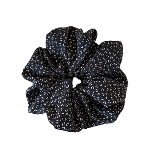 French vintage black scrunchie with white floral pattern for elegant ponytail styling