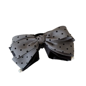 Elegant grey polka dot satin bow hair clip with pearl accents and large layered design