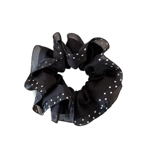 Chic black satin scrunchie with polka dot mesh lace trim for elegant ponytail styling