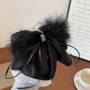 Elegant black satin bow hair claw clip with feathers and rhinestones for women