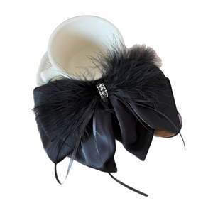 Elegant black satin bow hair claw clip with fluffy feathers and rhinestone accents