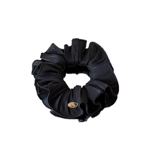 Elegant black pleated scrunchie with silk luster and a luxury gold metal buckle detail