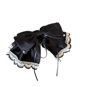 Elegant black satin bow hair clip with white lace trim and sparkling rhinestones
