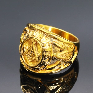Detailed relief of golden Freemason compass logo and Army engraving on steel ring
