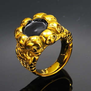 Anillo de calavera punk para hombre en acero inoxidable dorado con gema negra ovalada