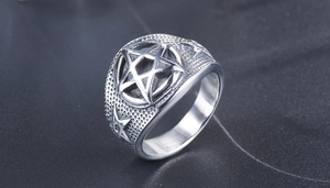 Detailed close-up of punk star ring with vintage silver finish and textured band