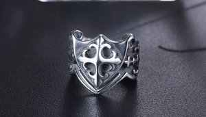 Macro shot of vintage gothic shield ring with a detailed 3D cross and matte finish