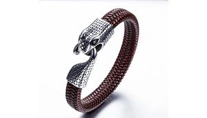 Detail of genuine braided leather bracelet with carved silver dragon head metal clasp