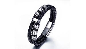 Close-up of black braided leather men's bracelet with polished stainless steel beads