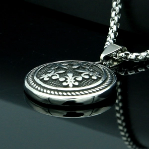 Stainless steel necklace featuring a 3D fleur-de-lis pendant on a silver box chain