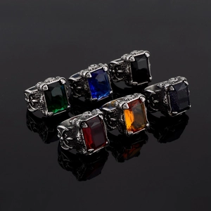 Detailed close-up of retro Viking rings featuring vintage silver eagle claw settings