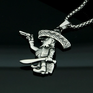 Macro detail of vintage pirate pendant with mini gun and sword in retro stainless steel