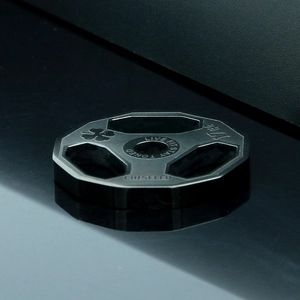 Detail view of black octagonal barbell weight pendant with Live Fit Stay Toned engraving