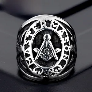 Detailed macro shot of vintage silver Master Mason ring with Masonic square and compass emblem