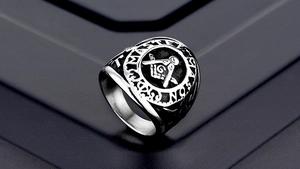 Macro shot of Master Mason Freemasonry emblem engraved on vintage stainless steel ring