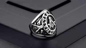 Macro shot of Freemason Master Mason ring featuring compass square logo and vintage details
