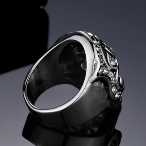 Gothic raven skull ring with red ruby eyes and pavé white zircons in gun black finish