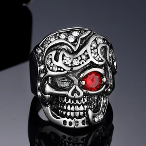 Gothic skull ring in silver steel with red ruby eyes and sparkling white crystals