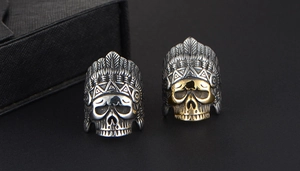 Detailed view of vintage punk skull rings with Indian feather headdress in retro style