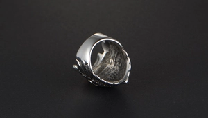 Close-up of vintage steel eagle chief ring with detailed feathers and punk carving