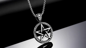 Macro shot of vintage silver moon and star pendant necklace with antique metal finish