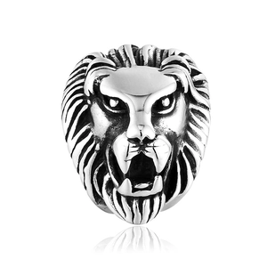 Macro shot of vintage silver lion head ring with detailed engraving and punk metal finish