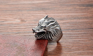 Detailed close-up of a punk style stainless steel wolf head ring with vintage silver finish