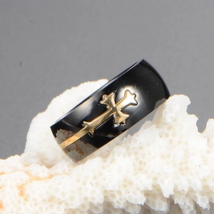 Men's black titanium steel cross ring featuring a gold decorative cross on a wide band