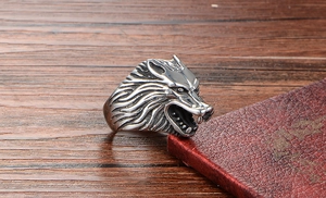 Close-up of vintage wolf head ring showing detailed fur texture and silver steel finish