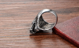 Close-up of vintage wolf skull ring in stainless steel with punk style carvings