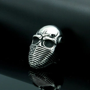 Macro detail of vintage silver skull ring featuring a detailed American flag mask design
