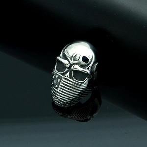 Macro shot of silver skull ring featuring American flag bandana and polished mirror finish