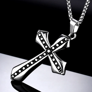 Vintage stainless steel cross pendant necklace with textured dots on a box chain